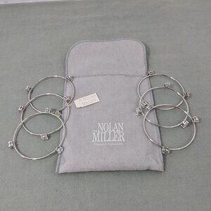 Pair of Nolan Miller silver triple bangle bracelets